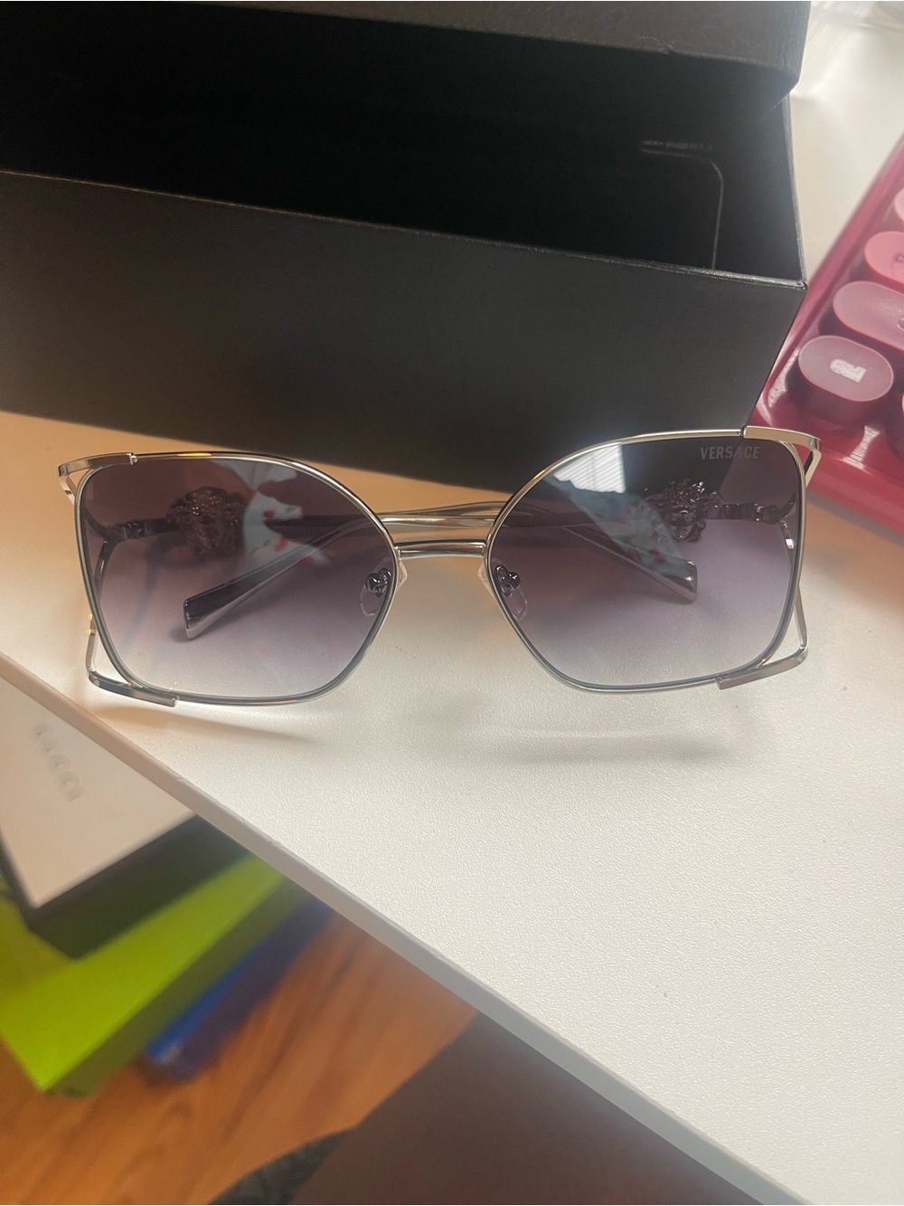 Women’s silver Versace glasses with grey tint